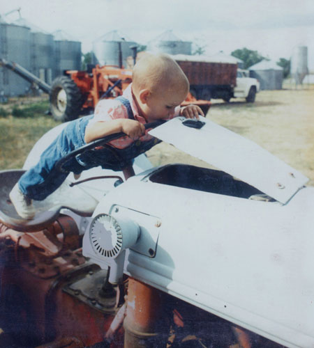 baby on a tractor
